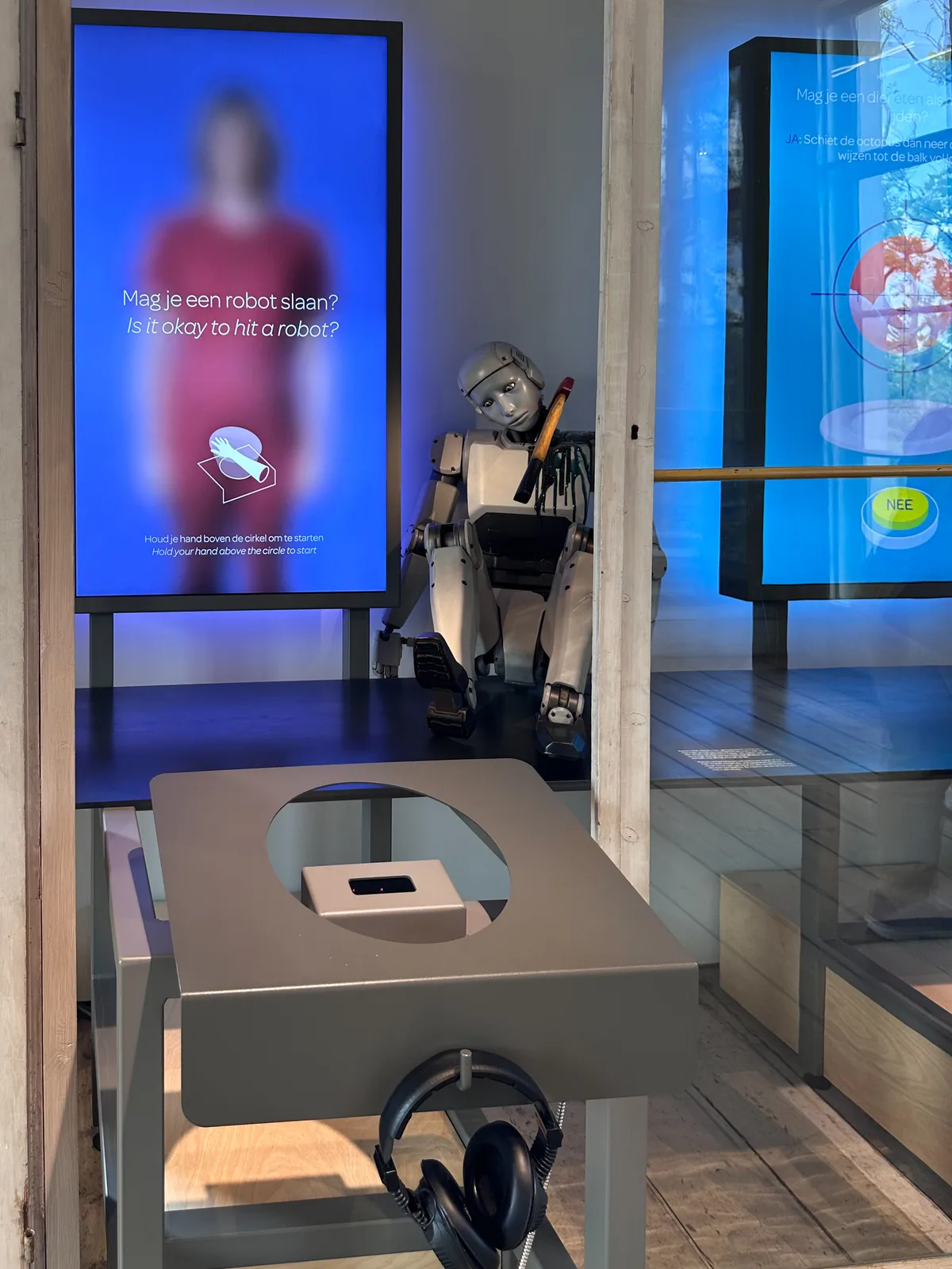 Visitors interacting with touch-based exhibits exploring human connection to nature at the Groote Museum